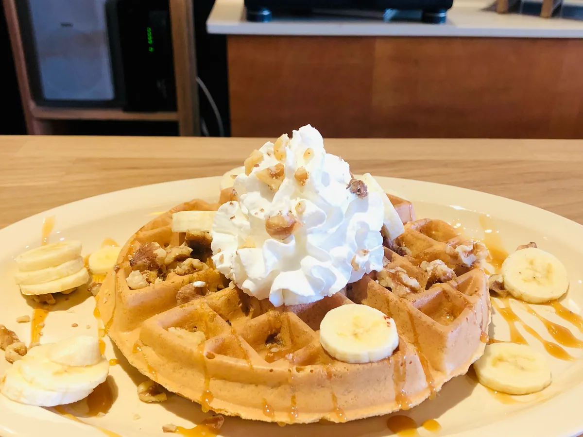 Banana caramel waffle with whipped cream